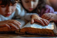 Two kid reading holy bible together publication child book. AI generated Image by rawpixel.