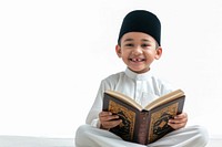 Asian Muslim boy sitting and reading Quran smiling child white background. AI generated Image by rawpixel.