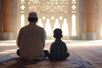 Muslim boy sitting and praying in Mosque with his dad adult spirituality togetherness. AI generated Image by rawpixel.