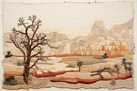 Desert needlework landscape tapestry.