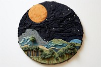 Planet embroidery art creativity.