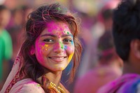 Indian woman with coloured on her face dancing in Holi festival in India holi portrait smile. AI generated Image by rawpixel.