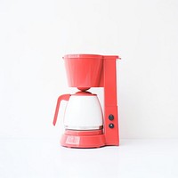 A minimal red coffee maker appliance mixer cup.