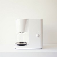 A minimal white coffee maker mixer coffeemaker technology.