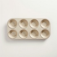 A beige muffin pan food tray white background.