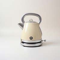 A beige retro minimal mini kettle small appliance technology cookware.