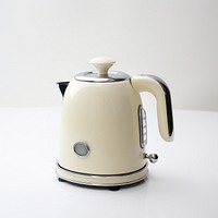 A beige retro minimal mini kettle small appliance technology cookware.