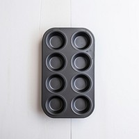 A black muffin pan arrangement electronics multimedia.