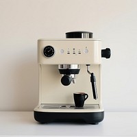 A black minimal beige coffee machine mixer coffeemaker technology.