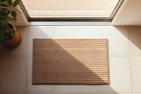 A brown door mat window floor architecture.