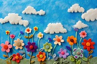 Photo of felt flower field on sky backgrounds embroidery textile.