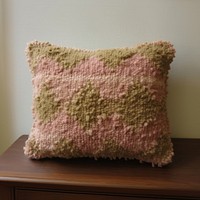 Hand tufted punch needle pillow cushion furniture clothing.