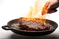 Steak on a pan grilling cooking meat. 