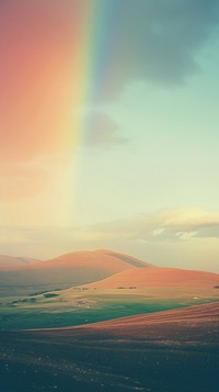 Photography rainbow with hillside landscape nature outdoors horizon.