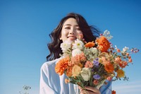 Asian woman holding bouquet flower plant adult. AI generated Image by rawpixel.
