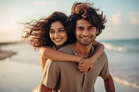 Young South Asian couple portrait smile beach. 