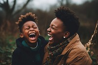 Black mother and son laughing adult togetherness.