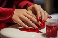 Client getting nail polish on finger cosmetics ketchup hand. AI generated Image by rawpixel.