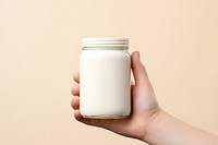 Jar  holding hand milk.