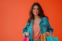Happy young Latin lady holding shopping bags handbag smile adult.