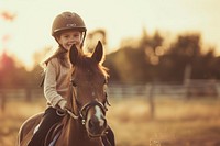 Joyful daughter riding horse with selfty helmet landscape mammal animal.