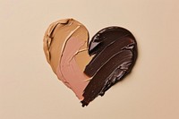 Makeup foundation swatch brown and pink brown shape heart chocolate dessert confectionery.