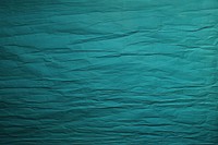 Folded turquoise paper texture paper backgrounds textured abstract.