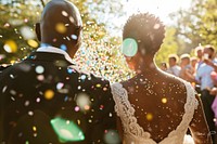 LGBTQ gay wedding bride and groom confetti outdoors romance.