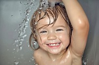 A happy kid washing hair bathroom bathing shower.