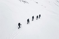 Sillhouette Black and white people hiking amoung snow recreation outdoors footwear.