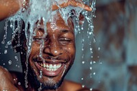 A happy black guy washing hair bathroom shower adult.