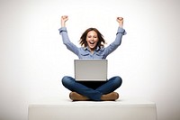 A happy woman sitting with her labtop and celebrating act computer laptop adult.