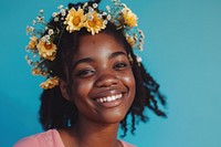 Young african american woman flower smile happy.