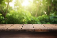 Wooden table with blur green nature background backgrounds sunlight hardwood. AI generated Image by rawpixel.
