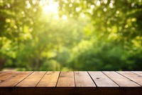 Wooden table with blur green nature background backgrounds sunlight outdoors. AI generated Image by rawpixel.