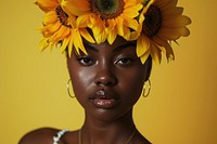 Young african american woman sunflower plant head.