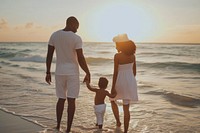 Happy black family traveling vacation outdoors sunset.