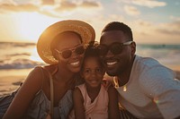 Happy black family traveling beach photography sunglasses.