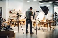 An artist in photographing studio tripod camera adult. AI generated Image by rawpixel.