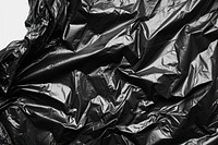 Smooth black plastic wrap backgrounds monochrome crumpled.