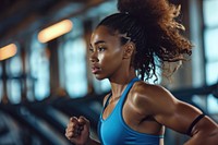 Black women running in the gym adult determination concentration.