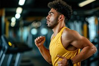 Hispanic man running adult gym determination.