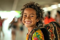 Happy Samoan kids portrait laughing backpack.