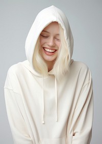A happy albino woman wear cream hoodie fashion sweatshirt portrait.