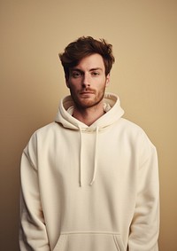 A happy british man wear cream hoodie sweatshirt portrait sweater.