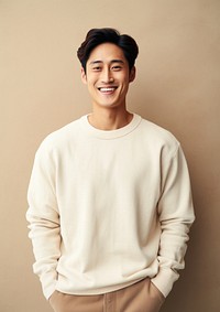 A happy mixed race korean man wear cream sweater smile architecture happiness.