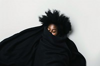 African afro woman in salon portrait blanket black.