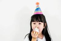 Asia girl eatting cupcake portrait birthday food.