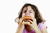 Girl eatting hamberger portrait biting eating.