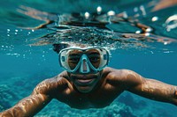 Happy samoan young diver diving underwater snorkeling recreation.